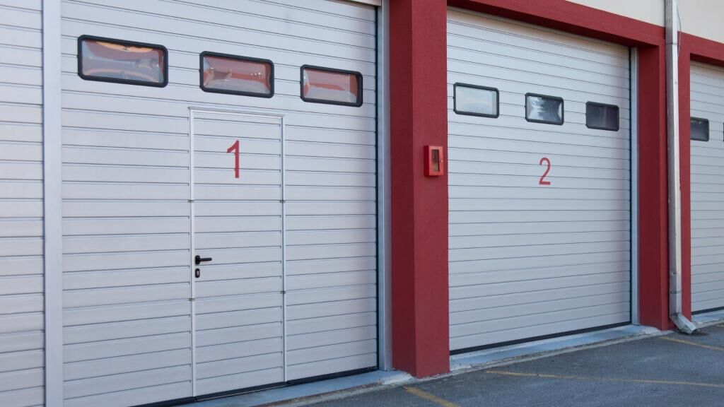 Warehouse garage doors with mandoor