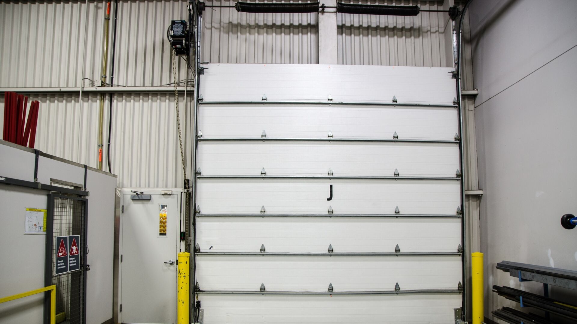 fix garage door A commercial garage door with jackshaft opener