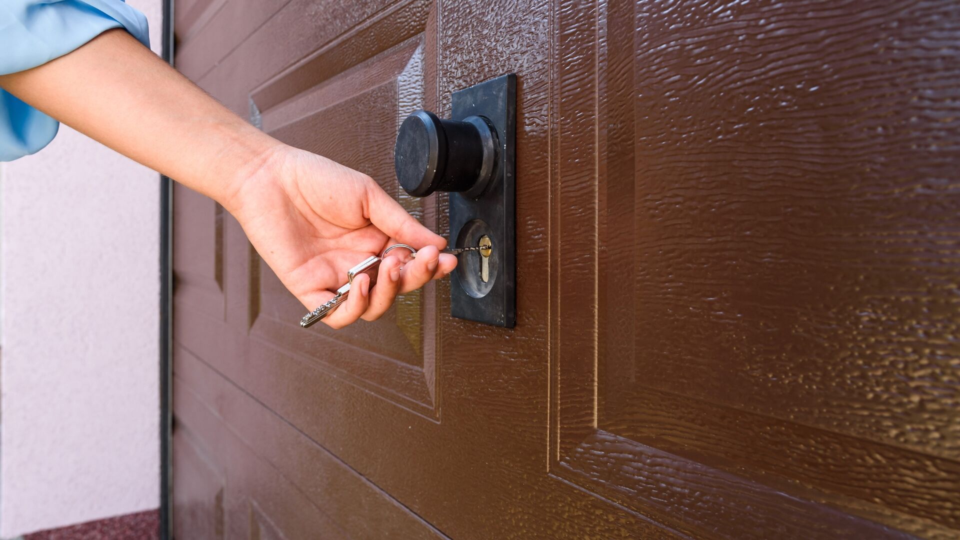 A woman opening a keyed lock