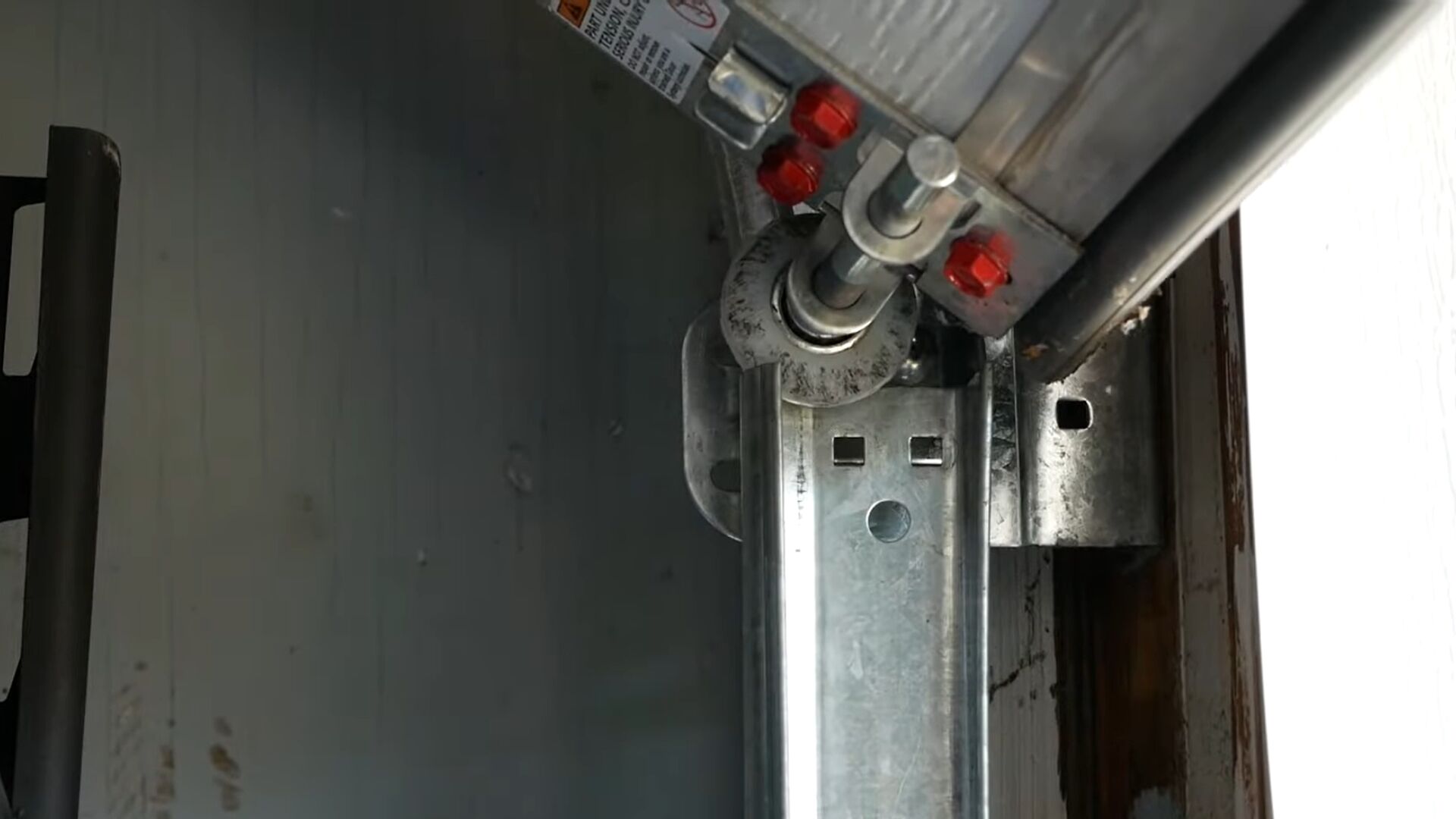 A misaligned track causing the garage door to go off-track