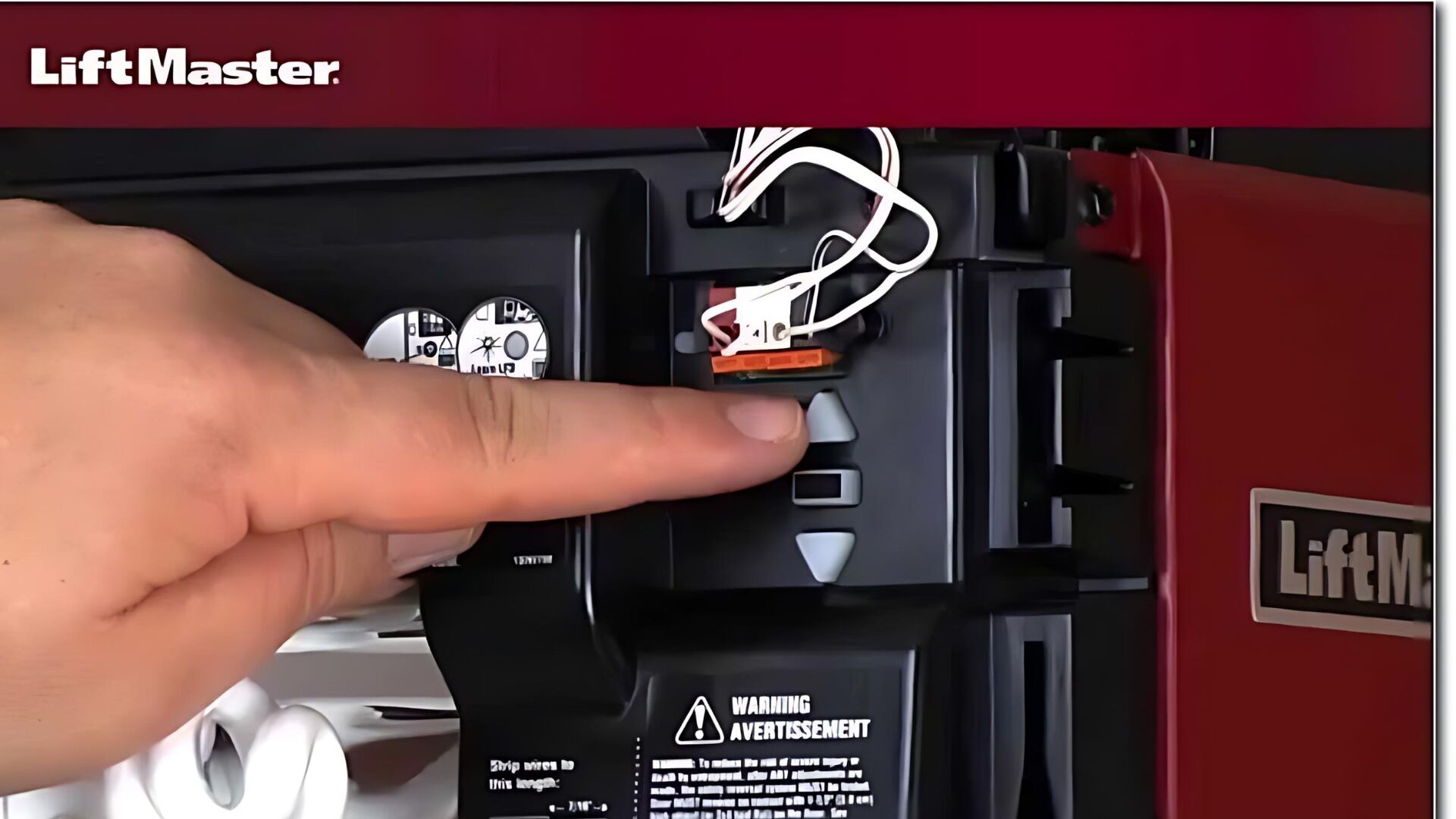 A man adjusting the down force and travel limits of the garage door opener