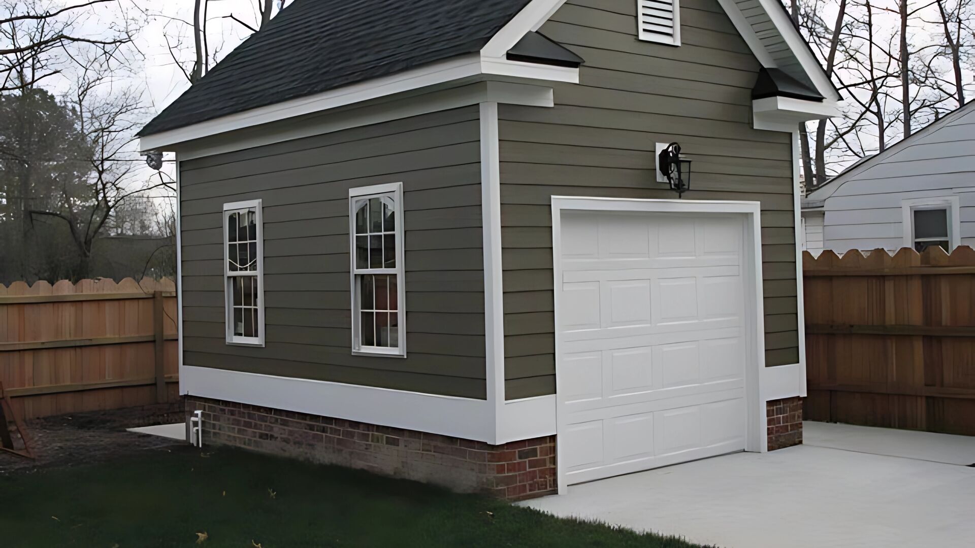 A stylish small garage door installed on a modern detached garage.